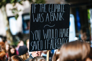Sign | If the climate was a bank, you would have saves it alredy