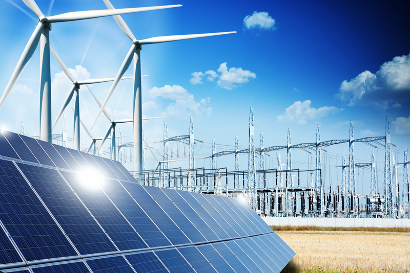 Modern electric grid lines and renewable energy concept with photovoltaic panels and wind turbines