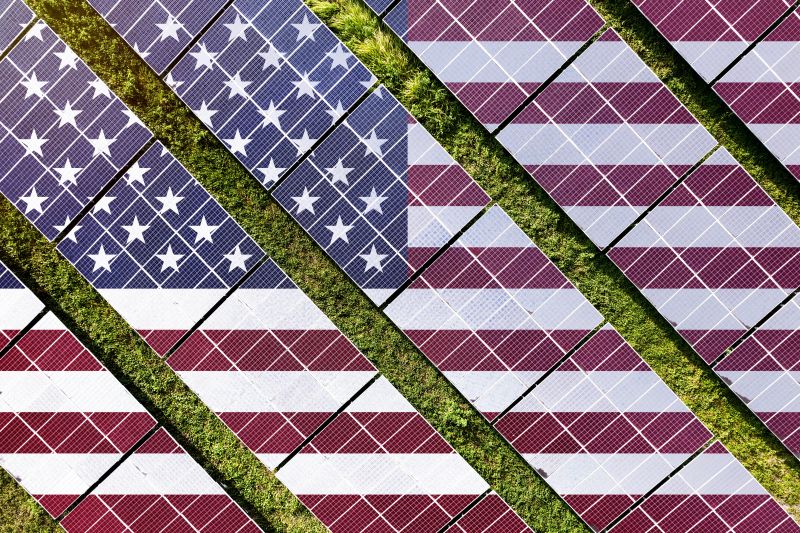 The US flag superimposed on a field of solar panels